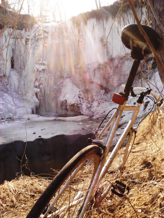 bike by frozen waterfall