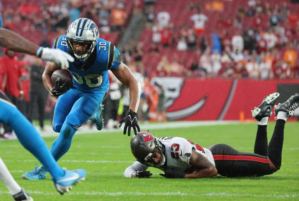 Dec 3, 2023; Tampa, Florida, USA; Carolina Panthers running back Chuba Hubbard (30) runs with the ball against the Tampa Bay Buccaneers during the first half at Raymond James Stadium. Mandatory Credit: Kim Klement Neitzel-USA TODAY Sports