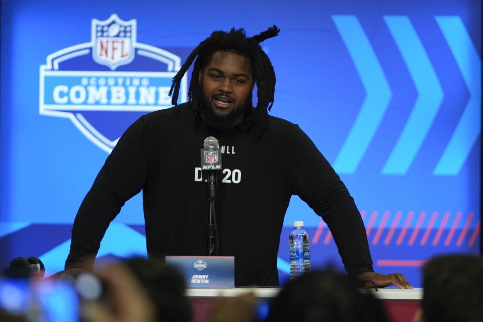 Illinois defensive lineman Johnny Newton speaks during a news conference at the NFL football scouting combine, Wednesday, Feb. 28, 2024, in Indianapolis. (AP Photo/Darron Cummings)