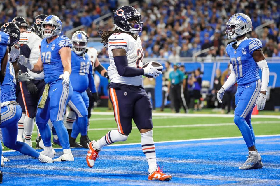 Chicago Bears running back <a class="link " href="https://sports.yahoo.com/nfl/players/30202" data-i13n="sec:content-canvas;subsec:anchor_text;elm:context_link" data-ylk="slk:D’Onta Foreman;sec:content-canvas;subsec:anchor_text;elm:context_link;itc:0">D’Onta Foreman</a> scores a 1-yard touchdown against the <a class="link " href="https://sports.yahoo.com/nfl/teams/detroit/" data-i13n="sec:content-canvas;subsec:anchor_text;elm:context_link" data-ylk="slk:Detroit Lions;sec:content-canvas;subsec:anchor_text;elm:context_link;itc:0">Detroit Lions</a> during the first quarter at Ford Field in Detroit on Sunday, Nov. 19, 2023.