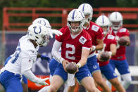 Indianapolis Colts quarterback Carson Wentz runs a drill during practice at the NFL team's football training camp in Westfield, Ind., Wednesday, July 28, 2021. (AP Photo/Michael Conroy)