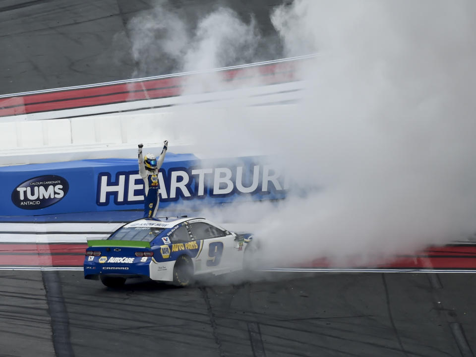 Chase Elliott (9) celebrates after winning a NASCAR Cup Series auto race at Charlotte Motor Speedway, Sunday, Sept. 29, 2019, in Concord, N.C. (AP Photo/Mike McCarn)