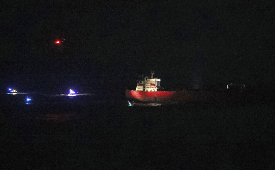 A a tanker at sea, on Sunday Oct. 25, 2020. British police and coast guard units have responded to an incident on an oil tanker in the English Channel after the crew reported they had stowaways onboard who had become verbally abusive. The incident began about 10 a.m. on the Libyan-registered tanker Nave Andromeda and was continuing Sunday night. (Steve Parsons/PA via AP)