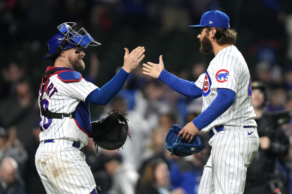 Chicago Cubs catcher Tucker Barnhart, left, celebrates with Anthony Kay after the team's 11-3 win over the Pittsburgh Pirates in a baseball game Tuesday, June 13, 2023, in Chicago. (AP Photo/Charles Rex Arbogast)