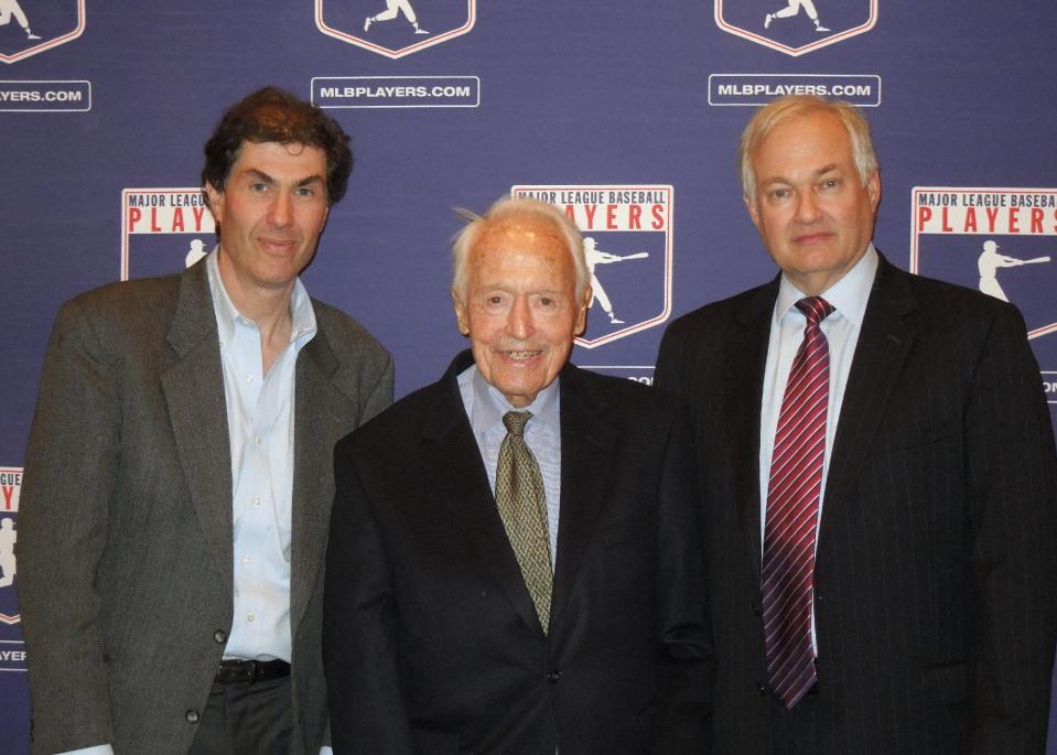 In this April 24, 2012 photo provided by the Major League Baseball Players Association, Michael Weiner, left, MLBPA executive director; Marvin Miller, center, former head of the association; and Donald Fehr, former MLBPA executive director and currently the executive director of the NHL Players' Association, gather for a photo at New York University School of Law in New York, where Miller discussed the 40th anniversary of the first baseball strike. Miller, the union leader who created free agency for baseball players and revolutionized professional sports with multimillion dollar contracts, died Tuesday, Nov. 27, 2012 in New York. He was 95. (AP Photo/MLBPA, Ashton Ramsburg, File)