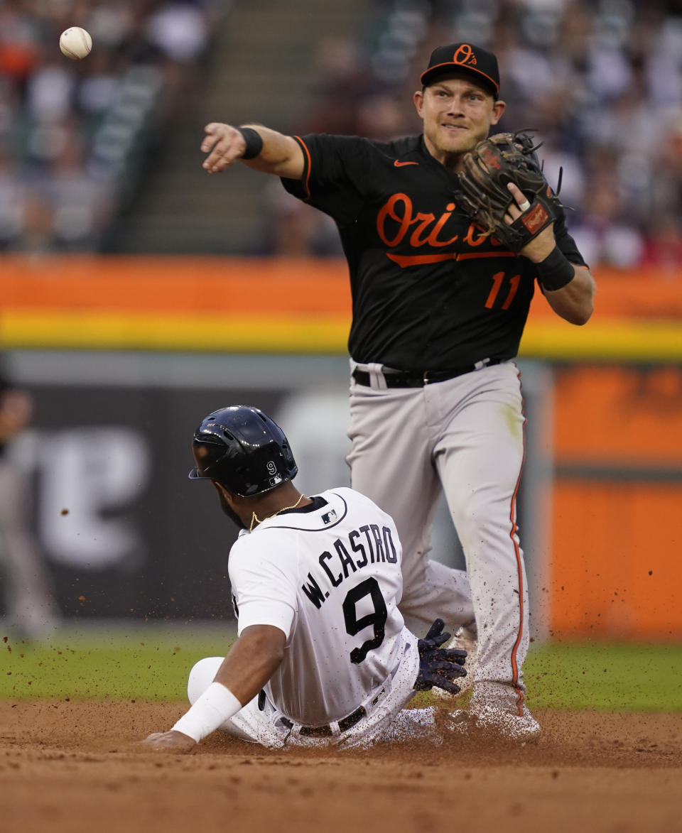 Detroit Tigers' Willi Castro is forced out at second as Baltimore Orioles second baseman Pat Valaika (11) throws to first to complete the double play hit into by Tigers' Derek Hill during the fifth inning of a baseball game, Friday, July 30, 2021, in Detroit. (AP Photo/Carlos Osorio)