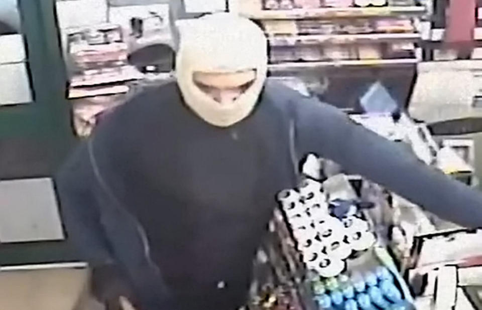 The men wore masks to carry out the robbery (Picture: SWNS)