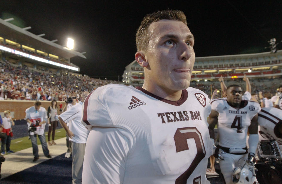 Texas A&M quarterback Johnny Manziel (2) looks into the stands for fans after he and his team defeated Mississippi in their NCAA college football game at Vaught-Hemingway Stadium in Oxford, Miss., Saturday, Oct. 12, 2013. No. 9 Texas A&M won 41-38. (AP Photo/Rogelio V. Solis)