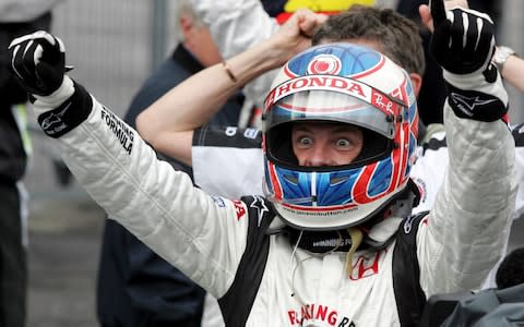 Britain's Honda driver Jenson Button celebrates after winning the Formula One Hungarian Grand Prix at the Hungaroring in Budapest Sunday, Aug.6, 2006 - Credit: AP