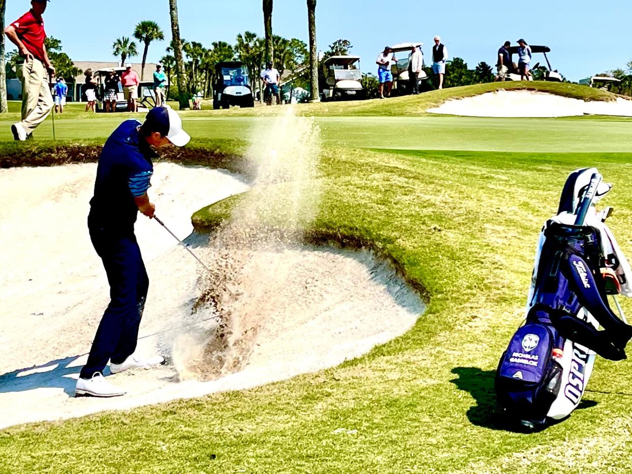 Nick Gabrelcik of the University of North Florida blasts out of a bunker on the 17th hole of the Sawgrass Country Club last year during The Hayt. Gabrelcik tied for medalist with Drew Doyle of LSU.