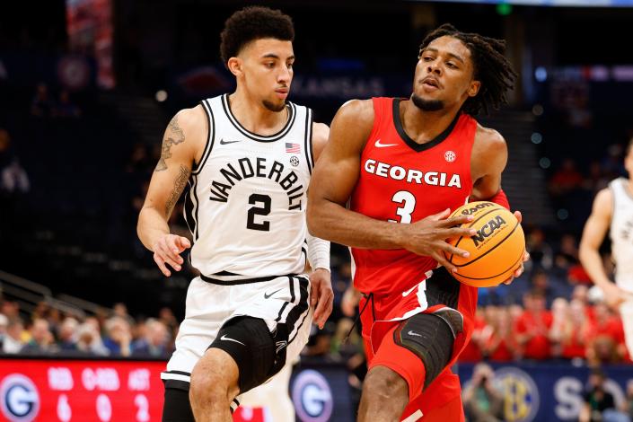 Georgia guard Kario Oquendo (3) drives to the basket past Vanderbilt Commodores guard Scotty Pippen Jr. (2) in the first half at Amelie Arena.