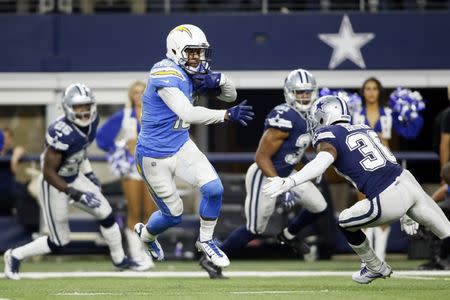 Nov 23, 2017; Arlington, TX, USA; Los Angeles Chargers wide receiver Keenan Allen (13) avoids the tackle of Dallas Cowboys cornerback Anthony Brown (30) and scores a touchdown in the fourth quarter at AT&T Stadium. Mandatory Credit: Tim Heitman-USA TODAY Sports