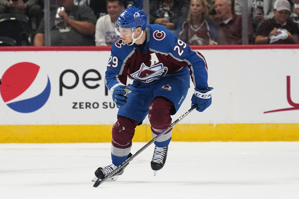 Colorado Avalanche center Nathan McKinnon (29) skates against the Dallas Stars during the second period of an NHL preseason hockey game Wednesday, Oct. 5, 2022, in Denver. (AP Photo/Jack Dempsey)