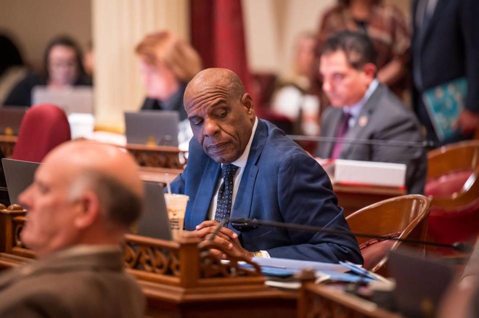 State Sen. Steven Bradford, D-Gardena, listens to conversation in the Senate chamber at the state Capitol on Thursday the final day of the legislative session. His Senate Bill 50 was pulled late in the night.