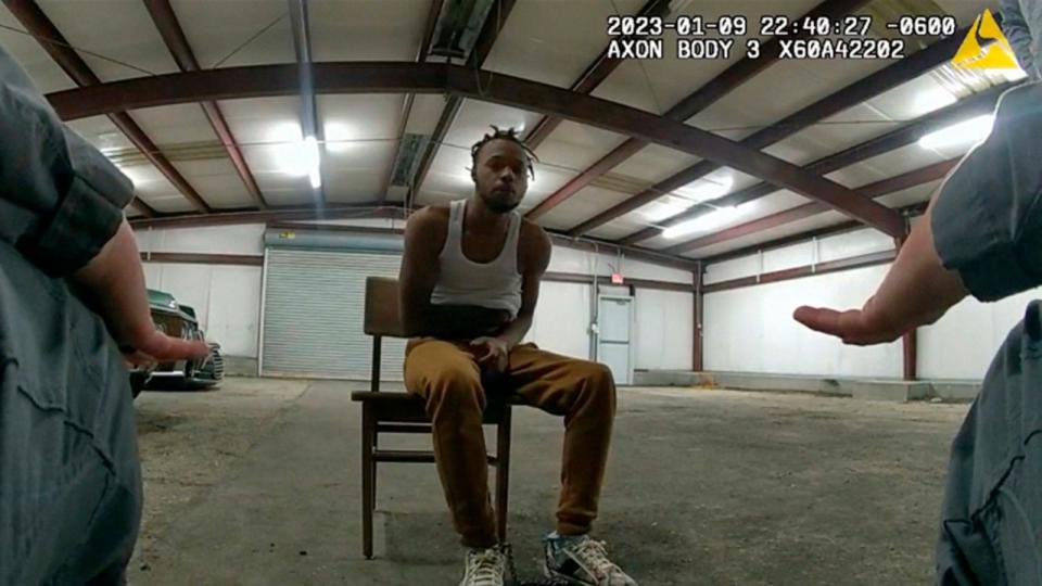 PHOTO: In this image from Baton Rouge Police Department body camera video, officers interact with Jeremy Lee inside a warehouse in Baton Rouge, on Jan. 9, 2023. (Baton Rouge Police Department via AP)