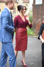 <p> Not every royal wears leather, but by keeping the structure and length classic (a midi pencil skirt works no matter what the material is), Meghan keep the whole vibe "professional but extremely cool looking." Also helpful: If your skirt is by Hugo Boss. Meghan matched the burgundy skirt with a deep red Joseph sweater and matching red suede Sarah Flint pumps. The other fun accessory: Prince Harry, who apparently was an unexpected plus-one! </p>