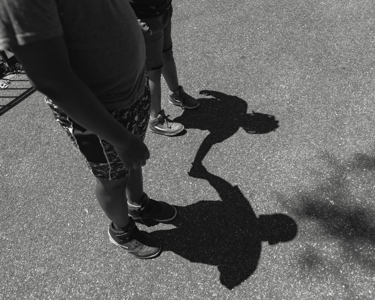 Shadows of two boys holding hands. (Stephanie Mei-Ling for NBC News and ProPublica)