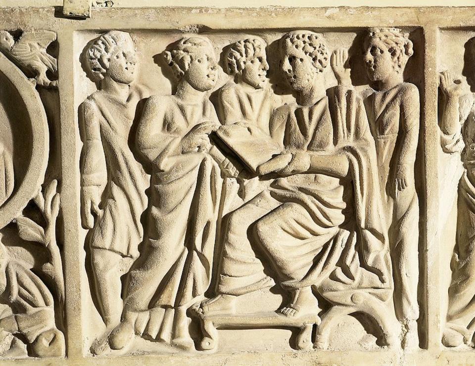 A relief from a sarcophagus portraying a rhetoric teacher with pupils. <a href="https://www.gettyimages.com/detail/news-photo/roman-civilization-4th-century-a-d-early-christian-news-photo/122319848?adppopup=true" rel="nofollow noopener" target="_blank" data-ylk="slk:Dea/A. Dagli Orti/De Agostini via Getty Images;elm:context_link;itc:0;sec:content-canvas" class="link ">Dea/A. Dagli Orti/De Agostini via Getty Images</a>