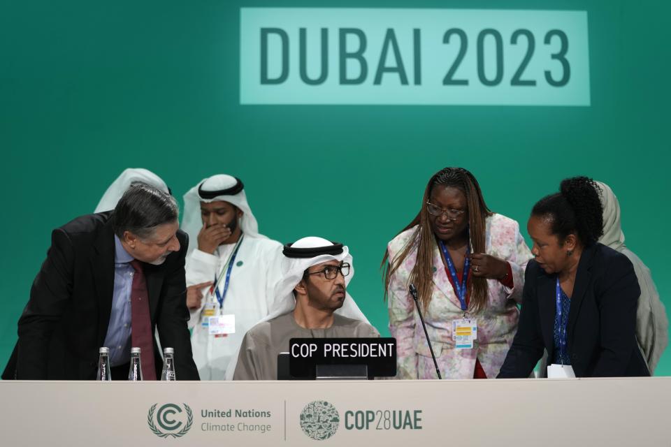 COP28 President Sultan al-Jaber, center, and COP28 CEO Adnan Amin speak ahead of a stocktaking plenary session at the COP28 U.N. Climate Summit, Saturday, Dec. 9, 2023, in Dubai, United Arab Emirates. (AP Photo/Peter Dejong)