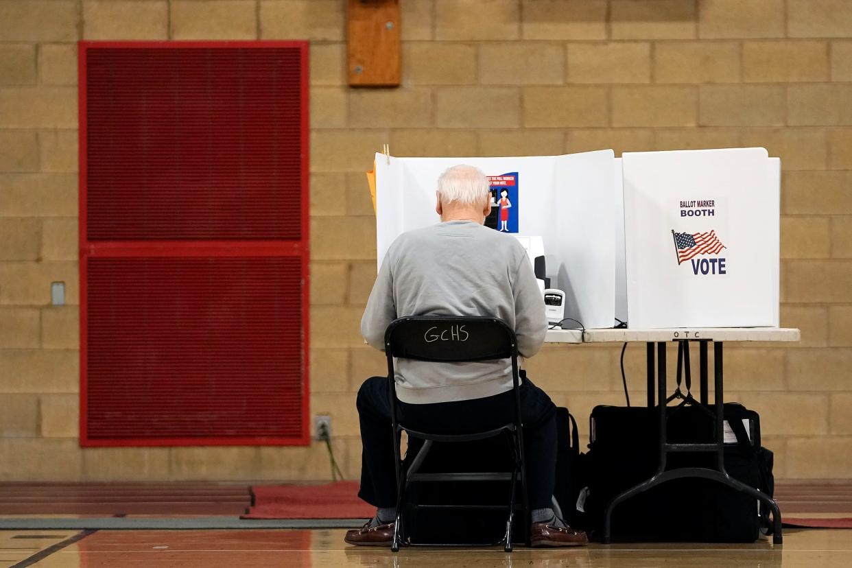 A voter makes his picks on primary Election Day at Grove City Recreation Center in Grove City, Ohio on May 3, 2022. 