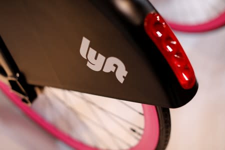FILE PHOTO: A Lyft bicycle is shown at the Lyft listing on the Nasdaq during an IPO event in Los Angeles
