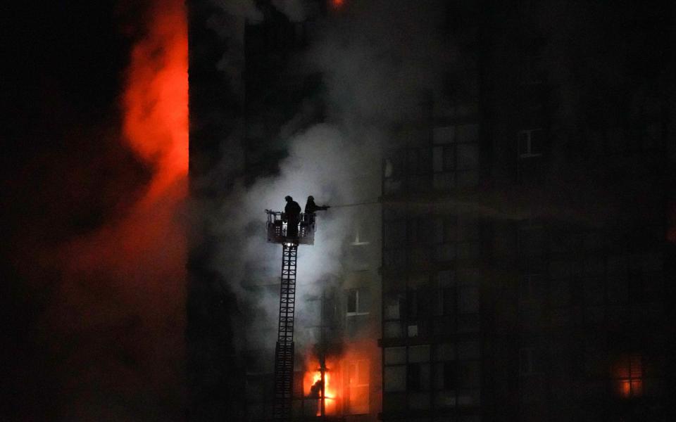 Firefighters tend to a blaze at the scene of an explosion from a vehicle crash in Ulaanbaatar, the capital of Mongolia on January 24, 2024