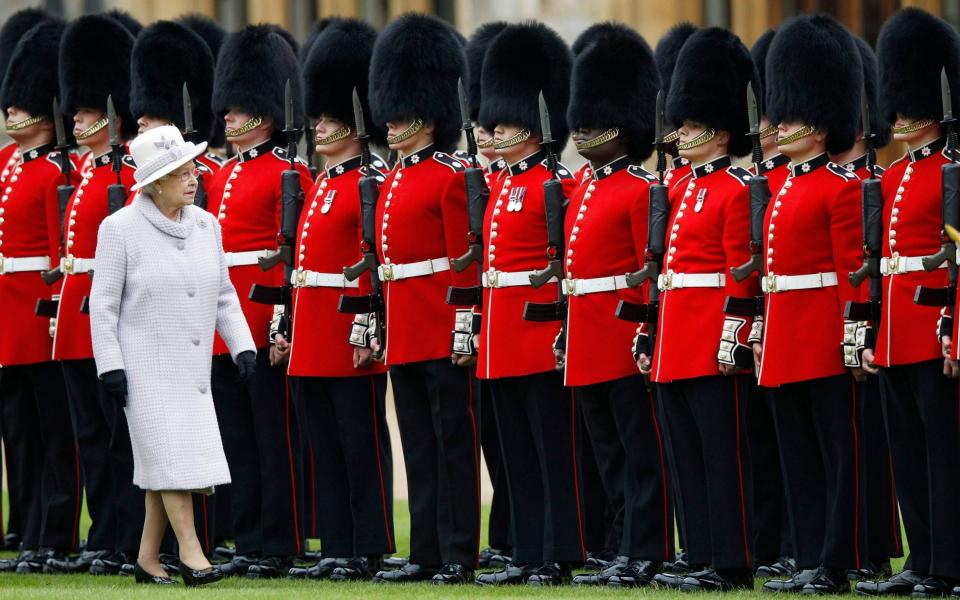 The Queen's guard wear bearskin hats - Getty