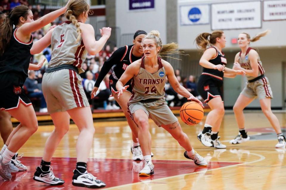 Transylvania’s Kennedi Stacy (24) dribbles the ball against Rhodes during a first-round NCAA Division III Tournament game at the Clive Beck Center on March 3.