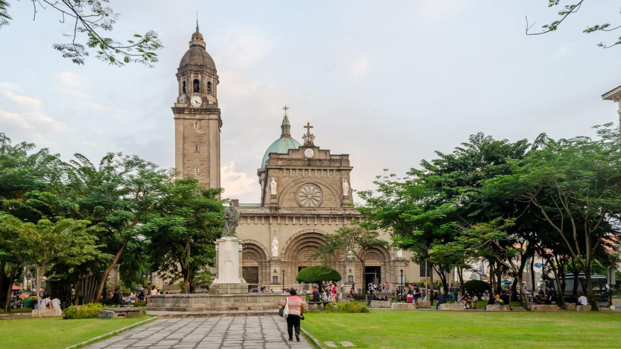 wide shot tourist visit cathedral intramuros manila, philippines