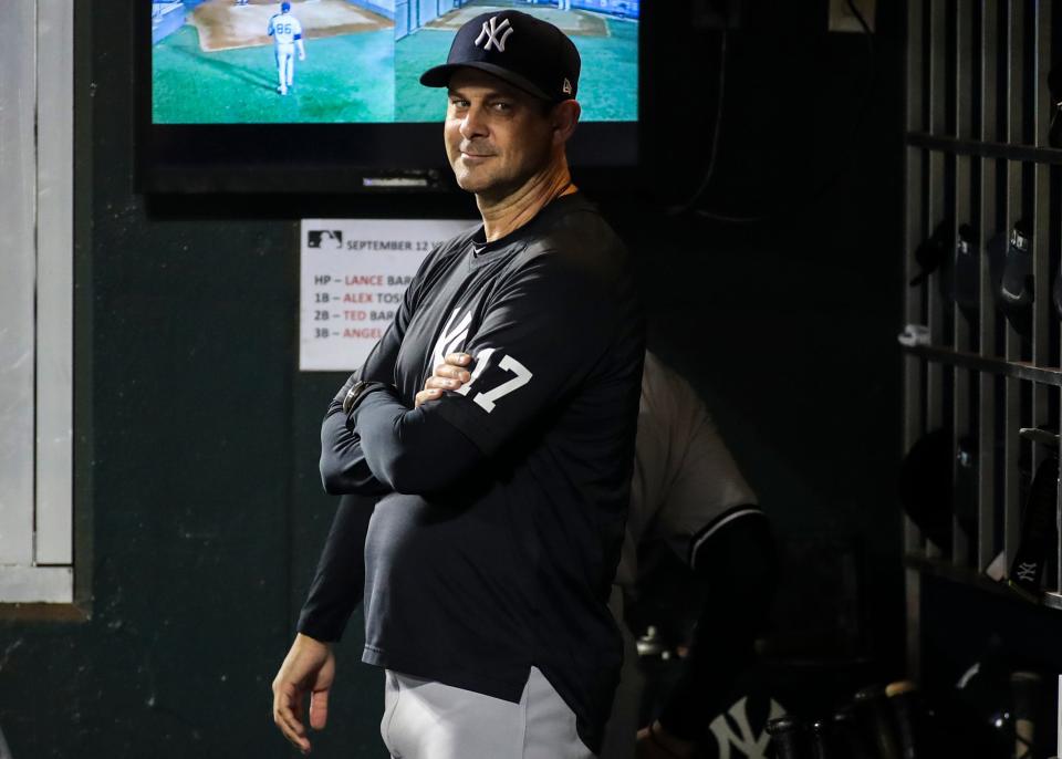 New York Yankees manager Aaron Boone (17) in the dugout prior to the game against the New York Mets at Citi Field.