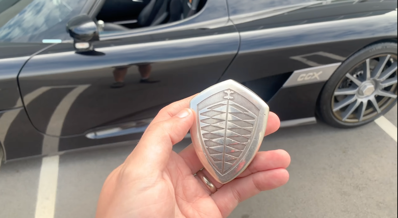 An image of the Koenigsegg CCX Roadster's beautiful key, in a shield shape like the Koenigsegg logo.