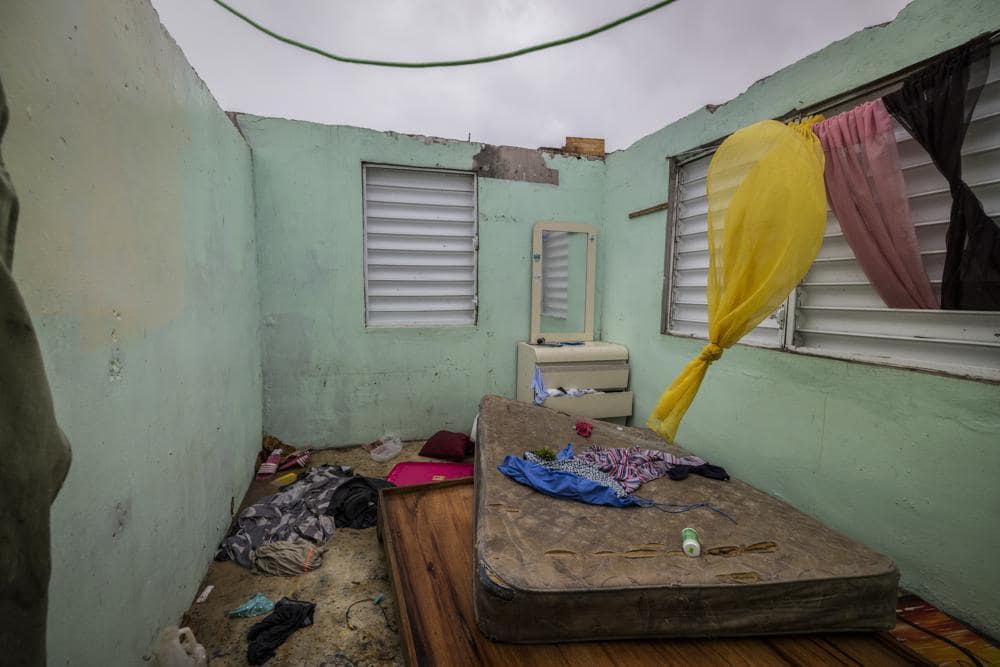 Nelson Cirino’s home stands with its roof torn off by the winds of Hurricane Fiona in Loiza, Puerto Rico, Sunday, Sept. 18, 2022.(AP Photo/Alejandro Granadillo)