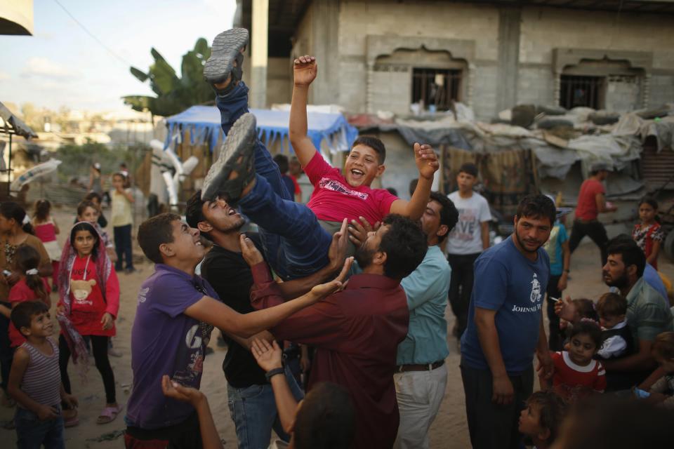 Young Palestinian groom Soboh is welcomed by relatives a day before wedding party in Beit Lahiya