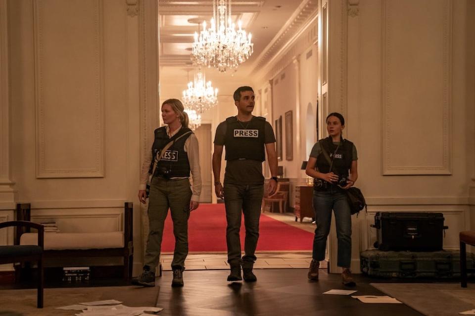 Lee (Kirsten Dunst, left), Joel (Wagner Moura) and Jessie (Cailee Spaeny) trail freedom fighters as they infiltrate the White House.