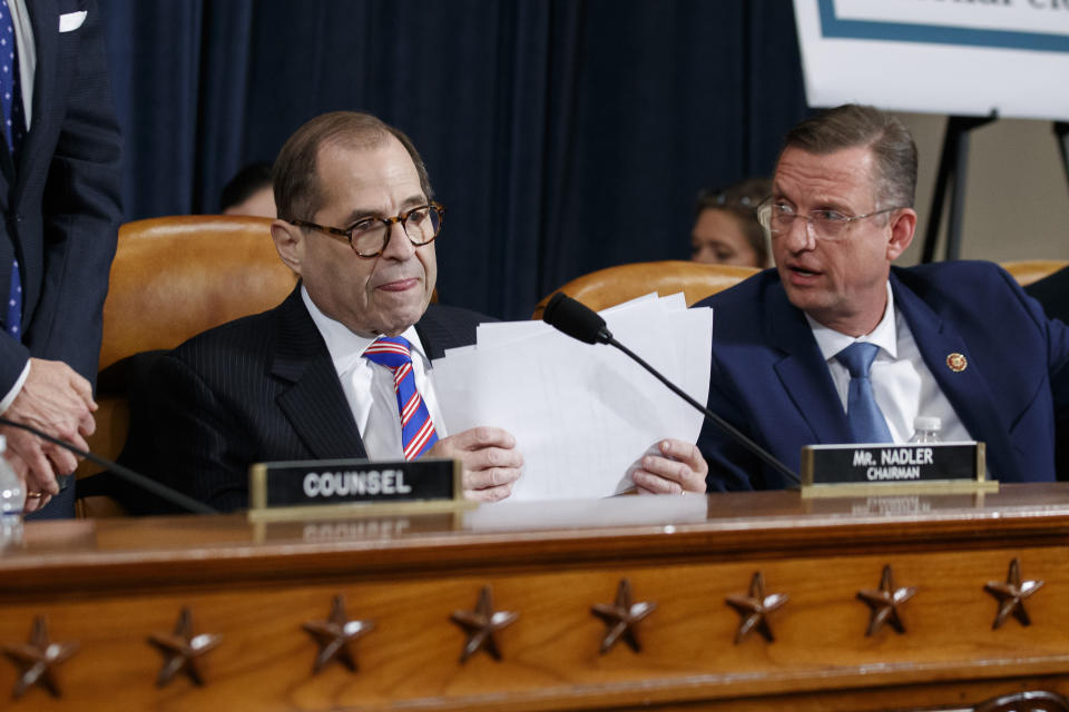 House Judiciary Committee Chairman Rep. Jerrold Nadler, D-N.Y., left, gathers his papers as ranking member Rep. Doug Collins, R-Ga., talks after the House Judiciary Committee hearing on the constitutional grounds for the impeachment of President Donald Trump, on Capitol Hill in Washington, Wednesday, Dec. 4, 2019 (AP Photo/Alex Brandon)