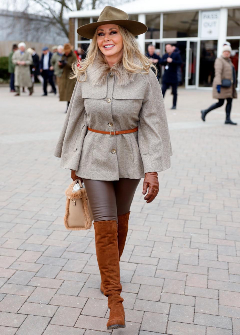 Carol Vorderman at Cheltenham proves you can pull-off leather trousers in your 60s. - Getty 