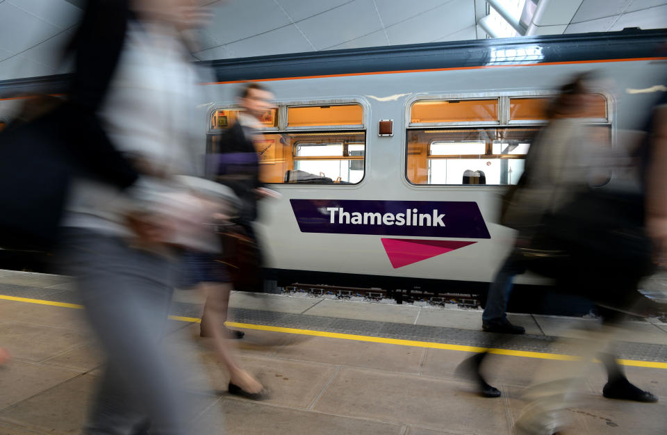 File photo dated 15/09/14 of commuters passing a Thameslink train as Govia Thameslink Railway (GTR) which has been under fire for delays caused by strikes and staff shortages is planning the &quot;biggest timetable shake-up&quot; in a generation.