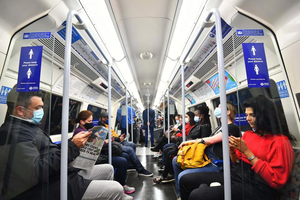 Commuters on the Tube (PA)