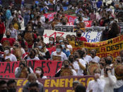 Relatives and classmates of the missing 43 Ayotzinapa college students and their supporters march in Mexico City, Monday, Sept. 26, 2022, on the day of the anniversary of the disappearance of the students in Iguala, Guerrero state. Three members of the military and a former federal attorney general were recently arrested in the case, and few now believe the government's initial claim that a local drug gang and allied local officials were wholly to blame for seizing and killing the students on July 26, 2014, most of which have never been found. (AP Photo/Marco Ugarte)