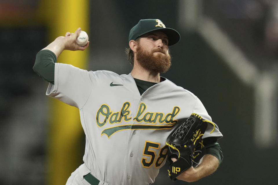 Oakland Athletics starting pitcher Paul Blackburn throws during the first inning of a baseball game against the Texas Rangers in Arlington, Texas, Friday, Sept. 8, 2023. (AP Photo/LM Otero)