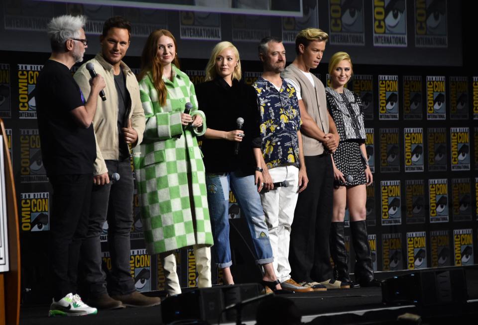 (From L) Director James Gunn, actor Chris Pratt Karen Gillan, Pom Klementieff, Sean Gunn, Will Poulter and Maria Bakalova present Guardians of the Galaxy Vol. 3 at the Marvel panel in Hall H of the convention center during Comic-Con International in San Diego, California, July 23, 2022. (Photo by Chris Delmas / AFP) (Photo by CHRIS DELMAS/AFP via Getty Images)