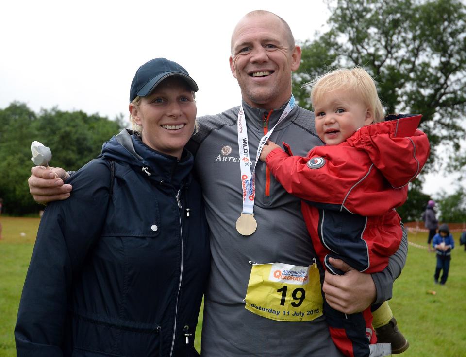 Zara Phillips and daughter Mia Tindall pose for a photograph after husband Ex England rugby star Mike Tindall finished the grueling Artemis Great Kindrochit Quadrathlon in Loch Tay Scotland on July 11, 2015 in Aberfeldy, Scotland