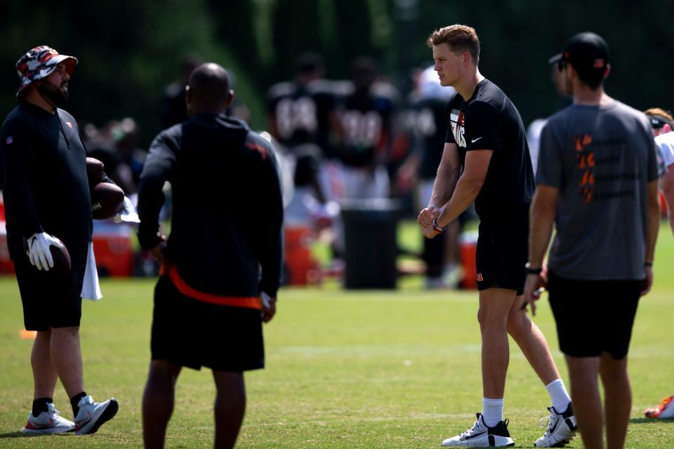 Cincinnati Bengals quarterback Joe Burrow (9) calls out a play while running through plays during Cincinnati Bengals preseason training camp at Paul Brown Stadium training facility in Cincinnati on Monday, Aug. 8, 2022.