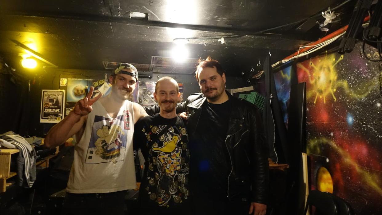 From left to right: Donavon O'Leary, Dana Wiesbrock and Adrien Harpelle, members of Ottawa punk band Twisted Limbs. The band played at House of Targ this weekend, their first live show since bandmate Riley Taylor died of an opioid overdose in 2022. (Anchal Sharma/CBC - image credit)