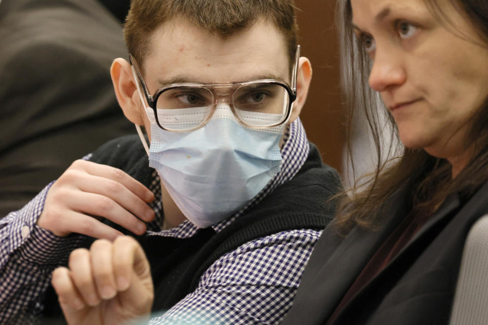 Marjory Stoneman Douglas High School shooter Nikolas Cruz speaks with sentence mitigation specialist Kate O'Shea during the penalty phase of his trial, Wednesday, July 6, 2022, at the Broward County Courthouse in Fort Lauderdale, Fla. (Carline Jean/South Florida Sun-Sentinel via AP)