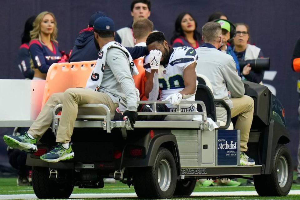 Seattle Seahawks defensive back Gavin Heslop (38) is taken off the field after and injury during the second half of an NFL football game against the Houston Texans, Sunday, Dec. 12, 2021, in Houston. (AP Photo/Eric Christian Smith)