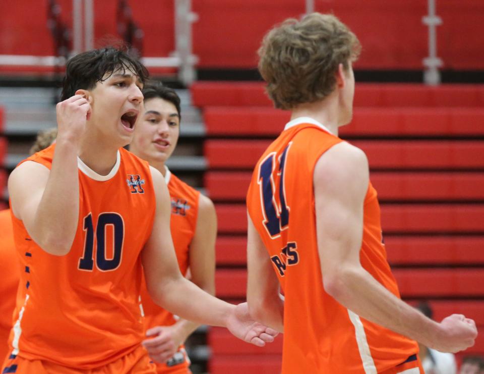 Harrison Raiders Luiz Pinto (10) and Harrison Raiders outside hitter Andrew Hostetler (11) celebrate during the IBVCA volleyball sectional championship match against the Westfield Shamrocks, Saturday, May 11, 2024, at Lafayette Jeff High School in Lafayette, Ind. Westfield won 3-0.