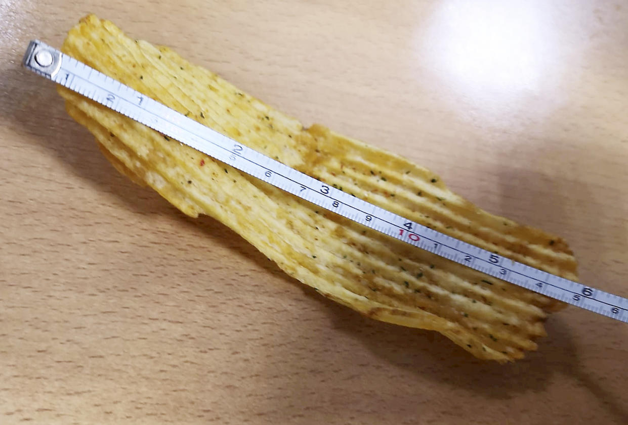 A man has found a crisp that is six inches long (Picture: SWNS)