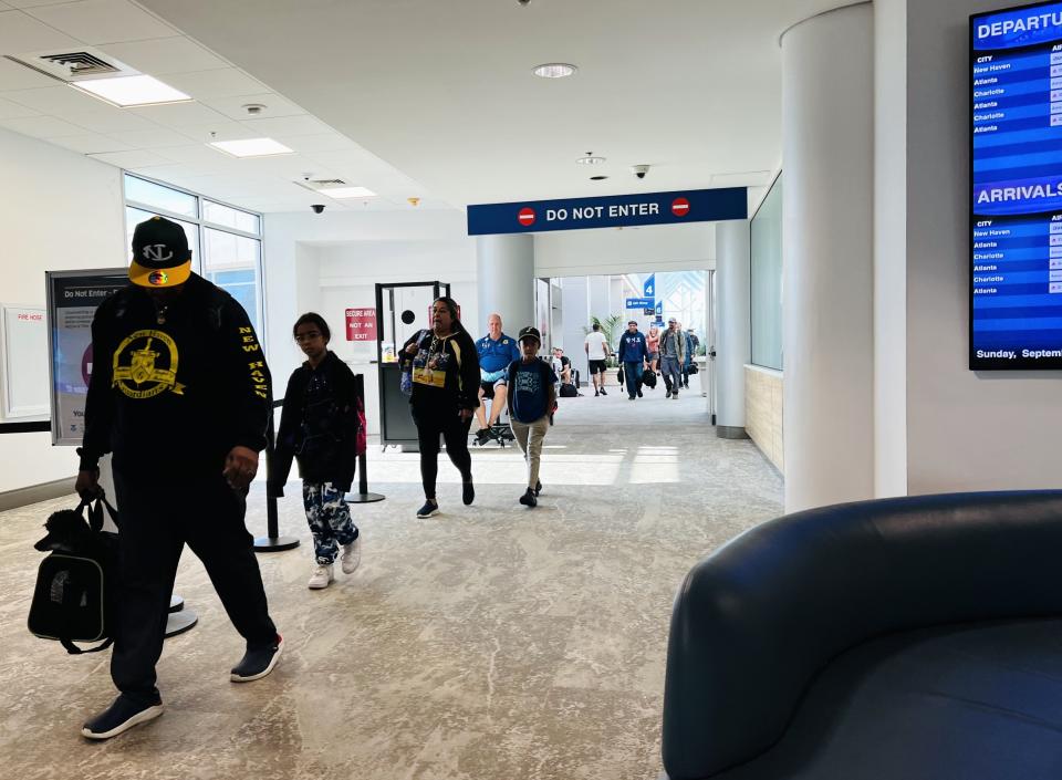 Air travelers arrive at Daytona Beach International Airport after taking a nonstop Avelo Airlines flight from New Haven, Connecticut, on Sept. 17, 2023.