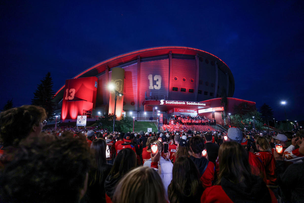 Photos: Hockey fans in Calgary gather at Scotiabank Saddledome as Flames host candlelight vigil for Johnny and Matthew Gaudreau